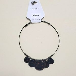 Necklace with tamped metal disks